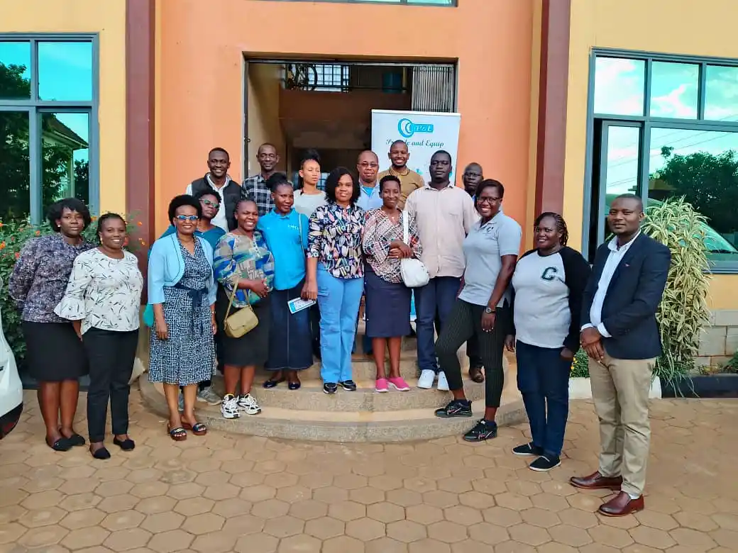 image of P&E Staff with the Uganda Christian University